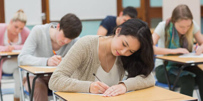 students taking a test in a classroom